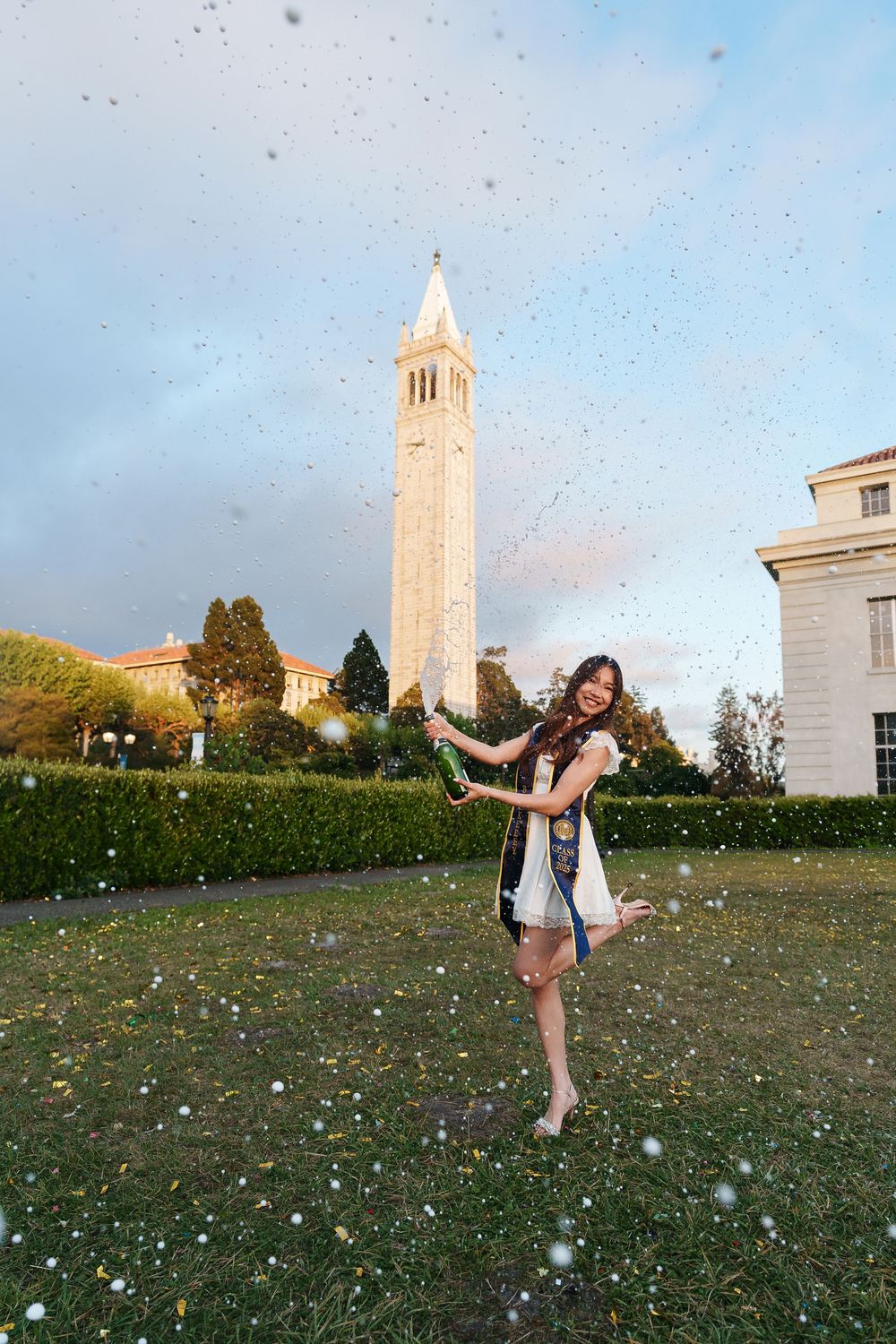 Graduate celebrating during a Bay Area portrait session by Chris Solorzano